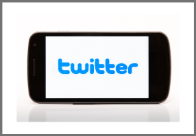  Cell phone with Twitter written in blue text